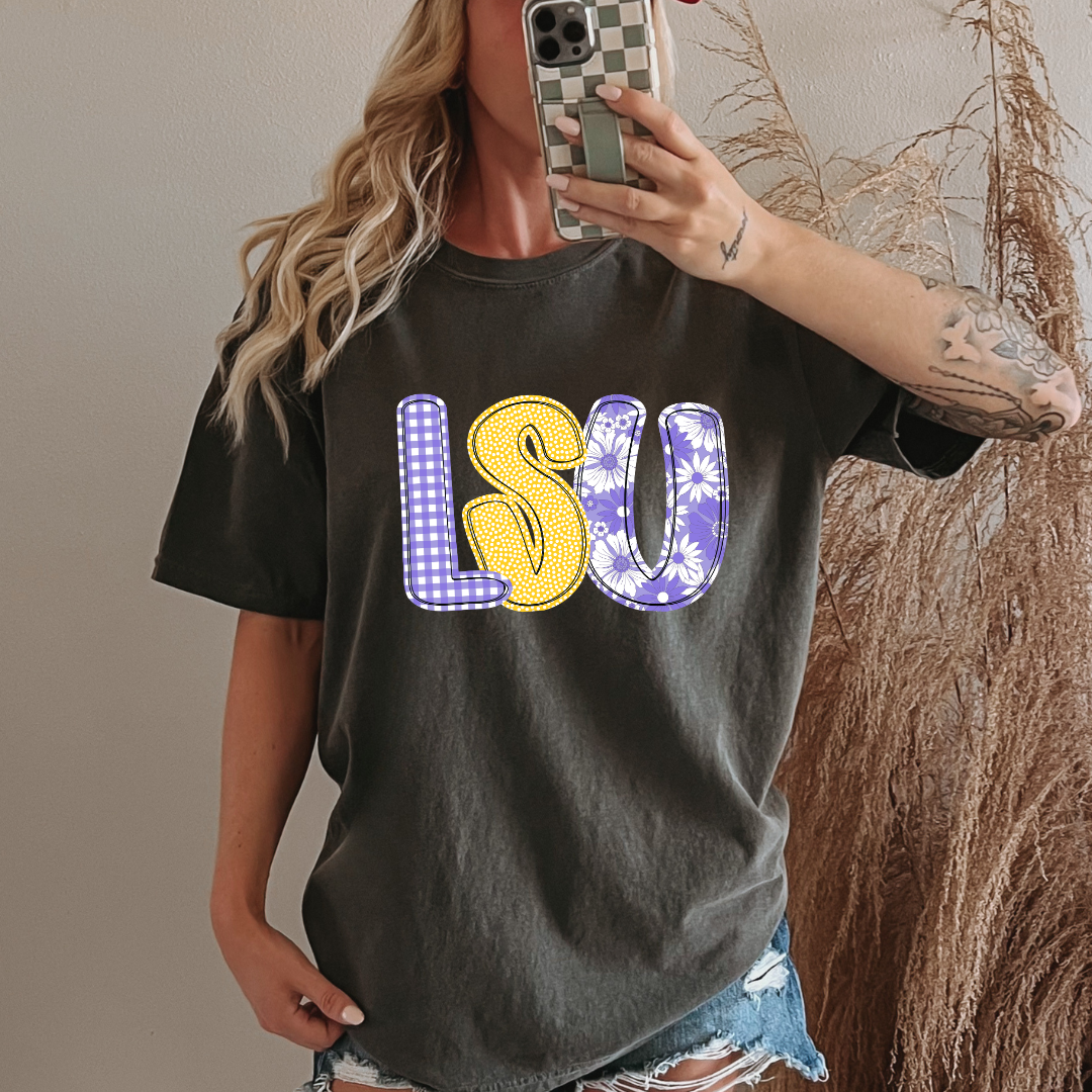 Person wearing a black t-shirt with 'LSU' printed on it