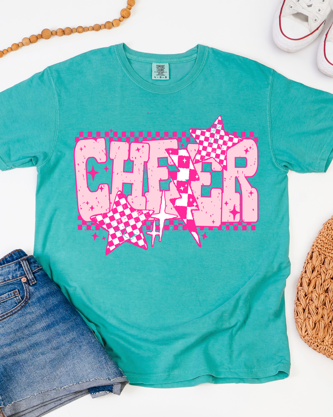 Teal t-shirt with pink 'CHEER' graphic on a white background