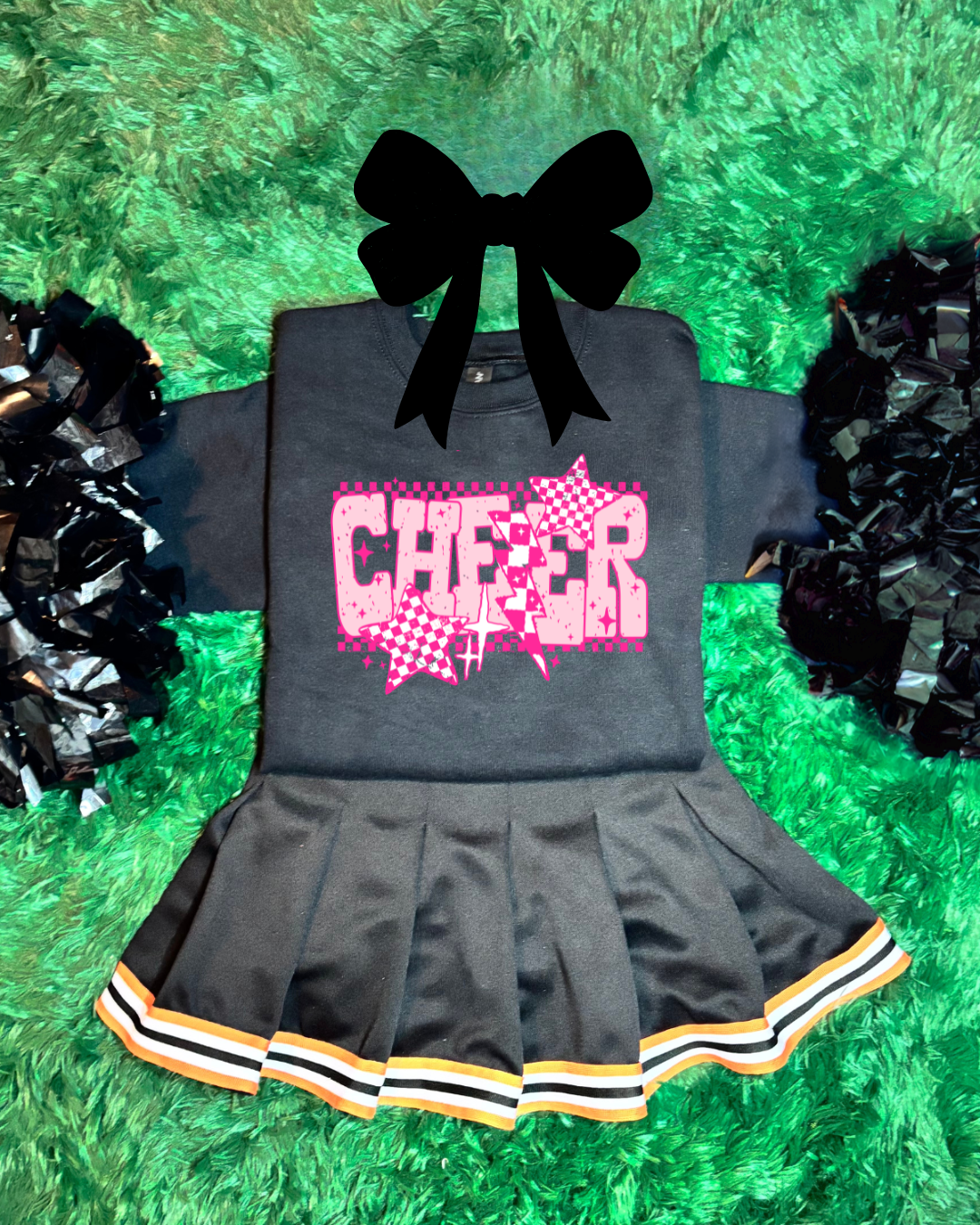 Gray cheerleading outfit with pink 'CHEER' design on a green grass background
