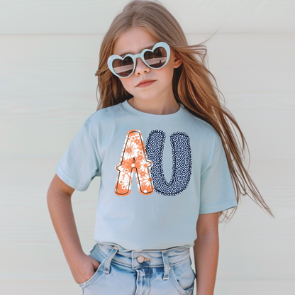 Child wearing a light blue t-shirt with decorative letters and heart-shaped sunglasses against a white background