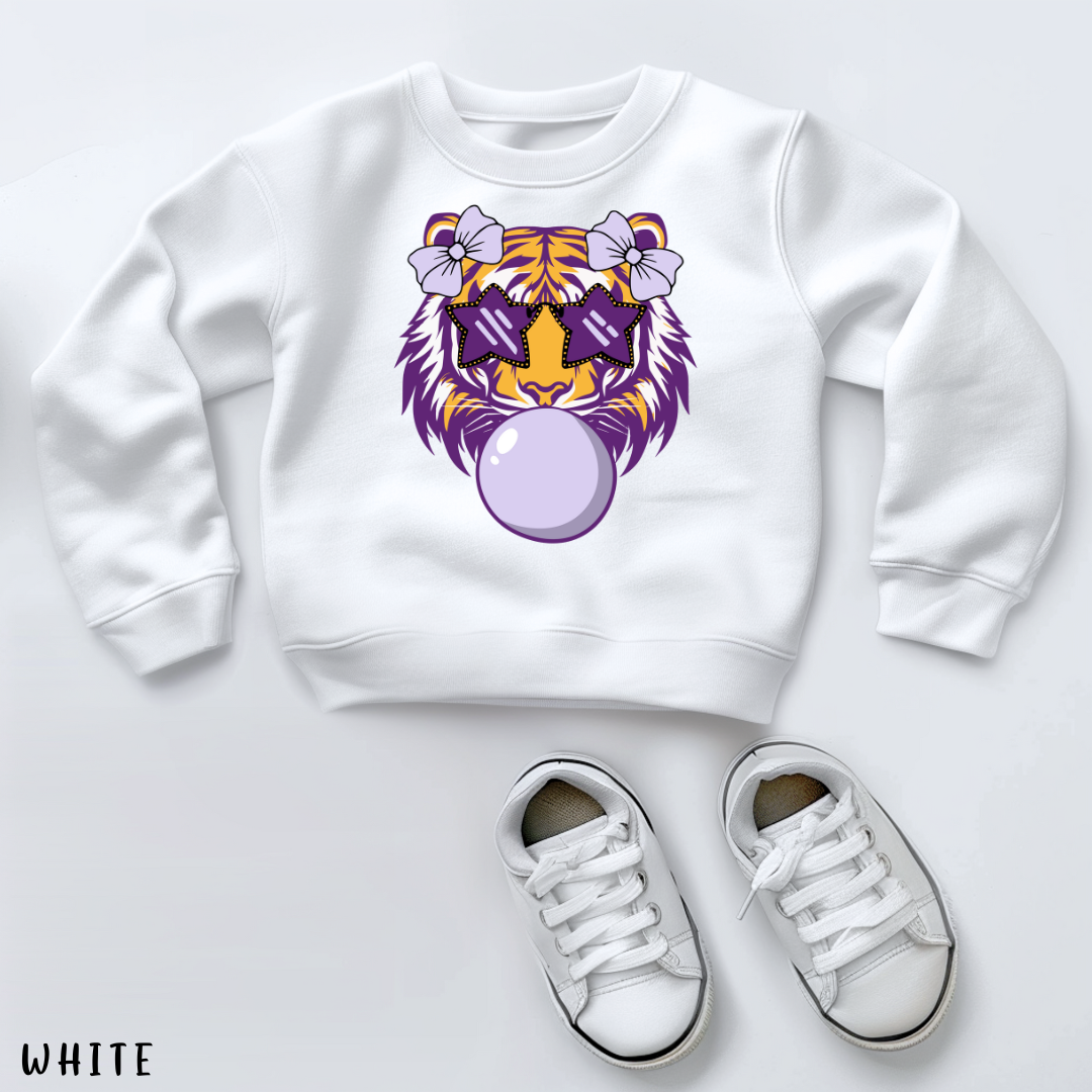 White sweatshirt with a tiger design and white sneakers on a light gray background