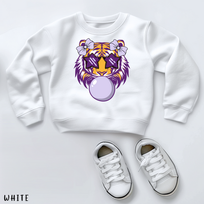 White sweatshirt with a tiger design and white sneakers on a light gray background