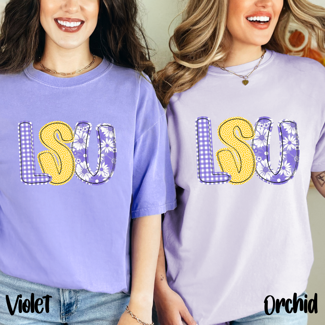 Two people wearing LSU t-shirts in violet and orchid colors.